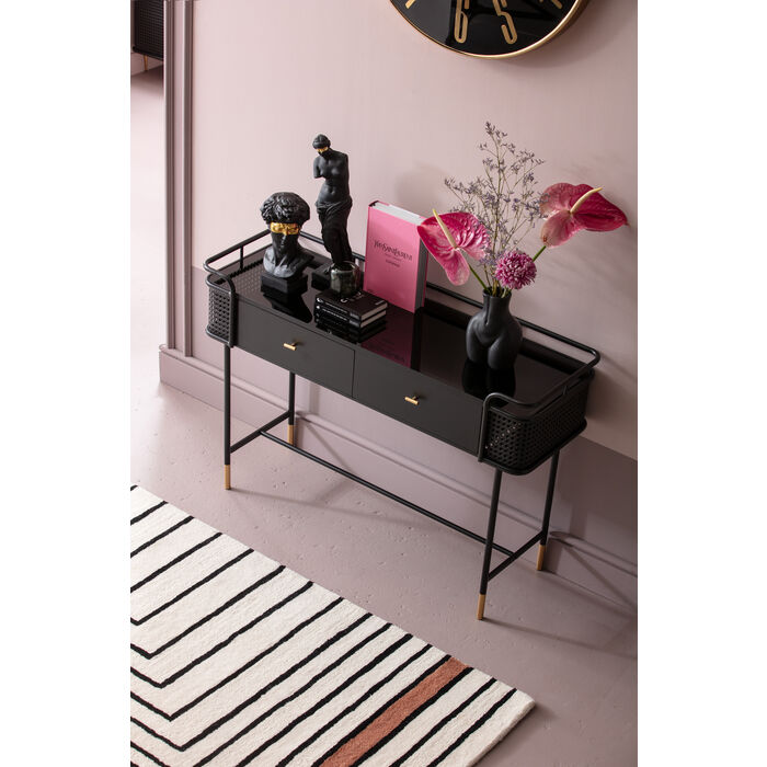 Styled console table with flowers, art, and tray accessories