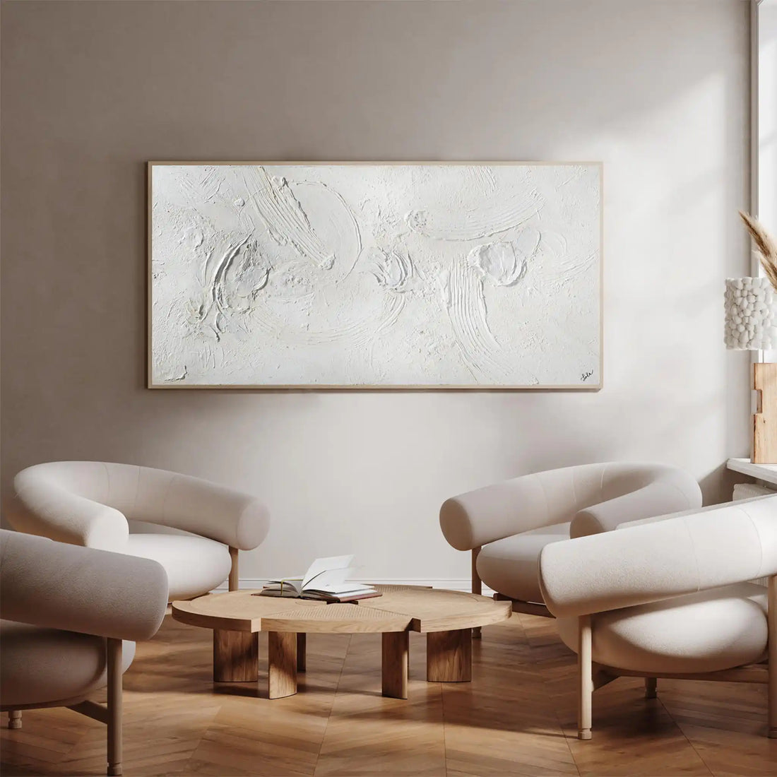 A framed abstract wall art piece featuring a textured, raised white design with organic swirls and circular forms, enclosed in a thin metallic frame against a plain white background.