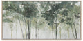 A framed horizontal canvas print depicting a misty forest with tall trees in soft shades of green, gray, and white, set in a light natural wood frame.