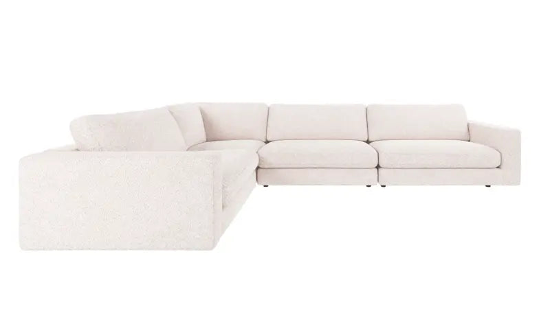 A light beige upholstered sectional sofa with a left-facing chaise lounge, shown from a three-quarter angle against a plain white background.