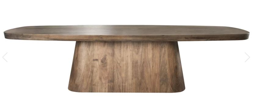Wooden dining table with a thick base on a white background