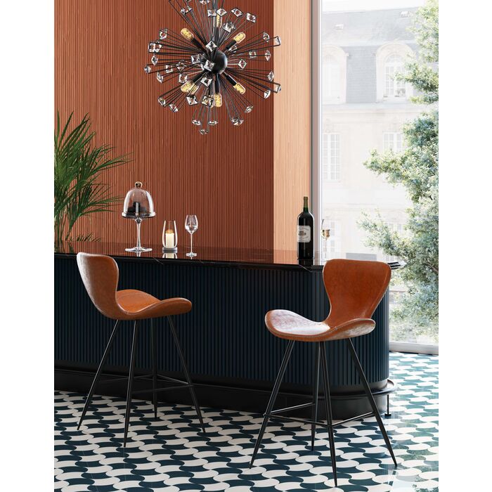 A modern counter stool with a curved, sculptural seat and back upholstered in warm brown leather, supported by a slim black metal frame with four legs.