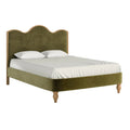Green upholstered bed with white bedding on a white background