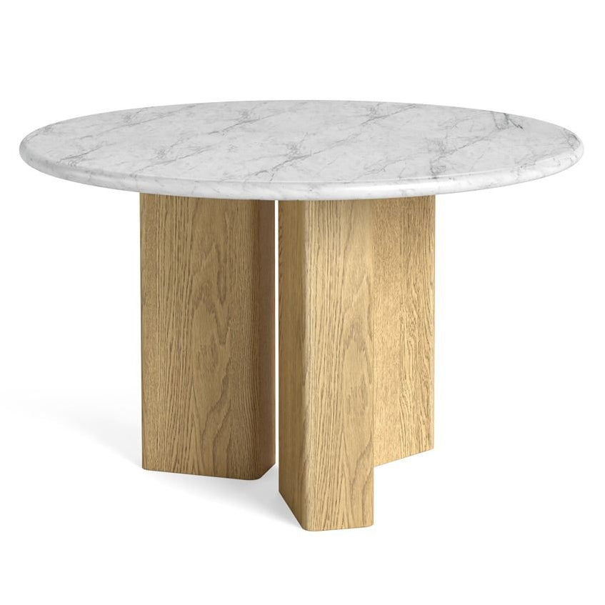 Round dining table with marble top and wooden legs on a white background