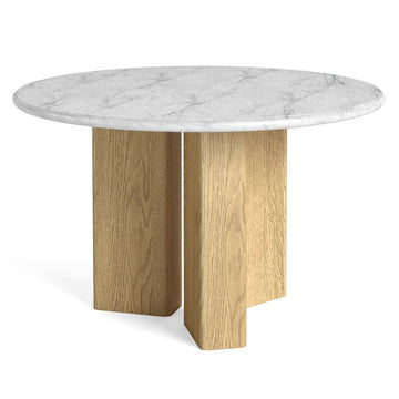 Round dining table with marble top and wooden legs on a white background