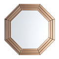 Hexagonal mirror with a bronze frame on a white background