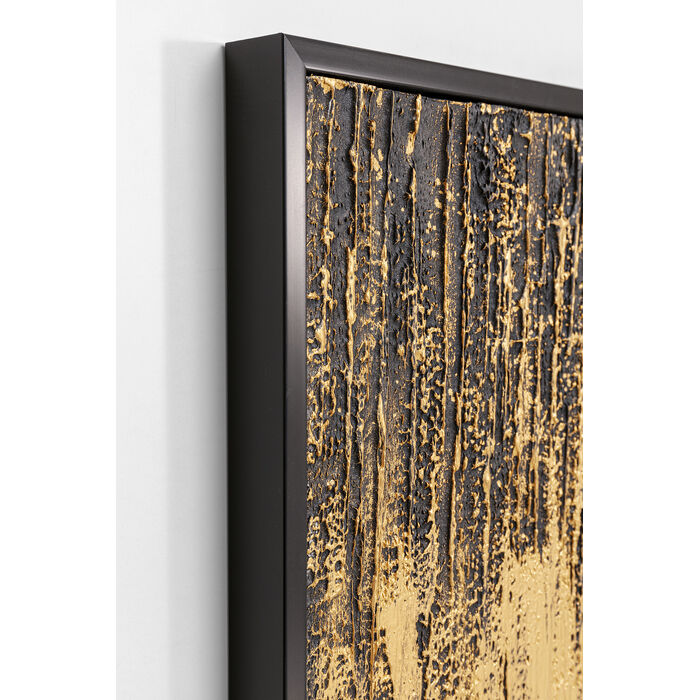 Abstract framed wall art featuring a textured, distressed pattern of metallic gold paint dripping over a dark charcoal black background, enclosed in a thin black frame.