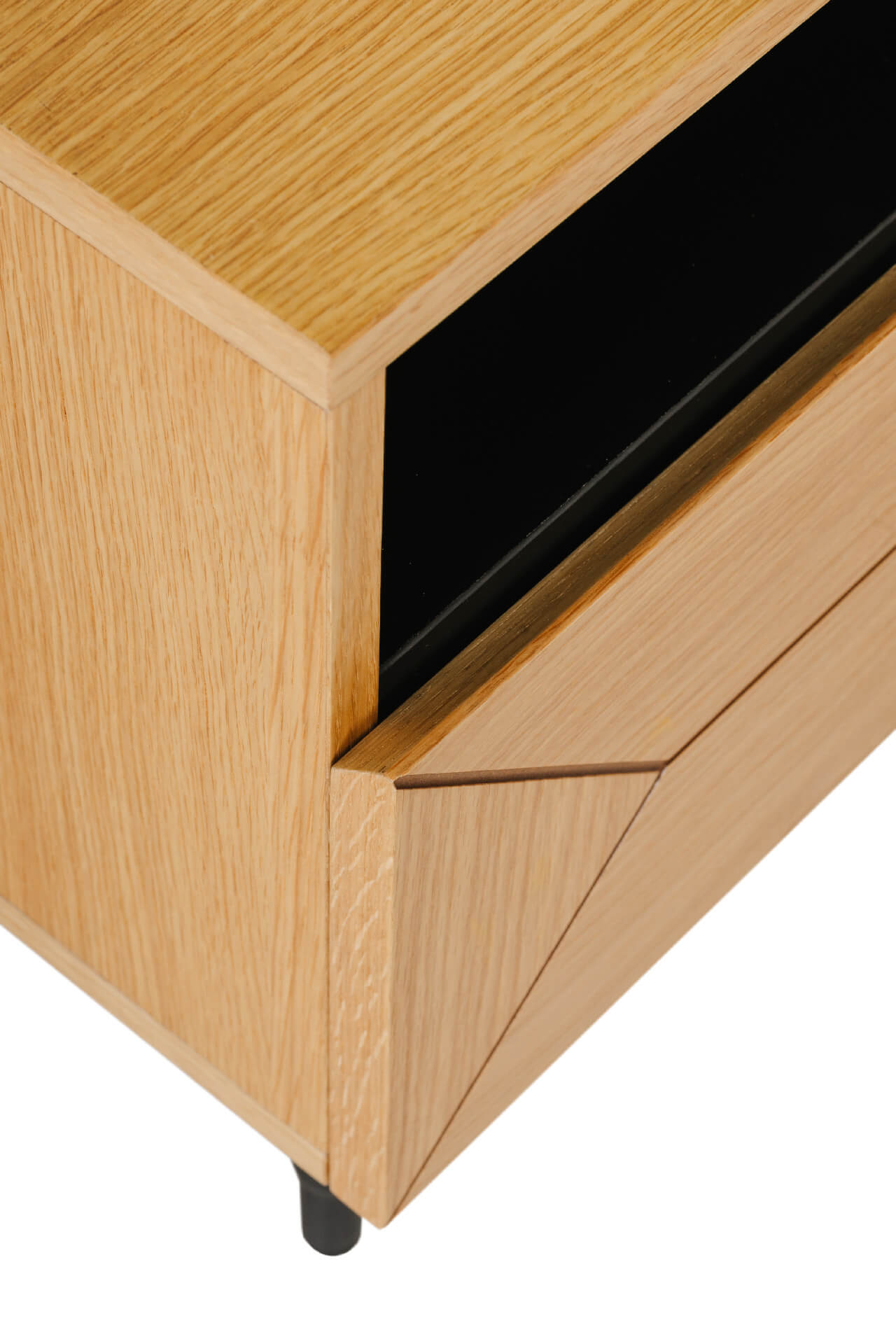 Wooden cabinet with a black panel on a white background