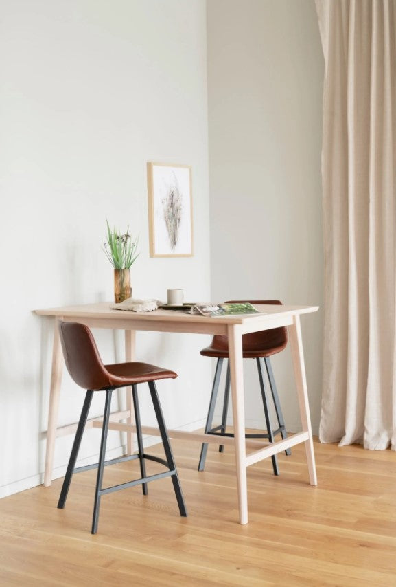 Brown bar stool with black legs on a white background
