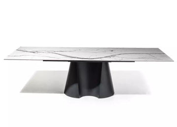 Dining table with marble top and black base on a white background