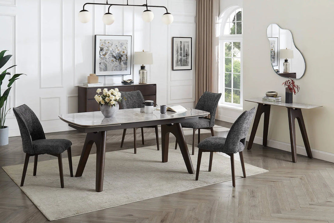Dining table with marble-like top and wooden legs on a white background