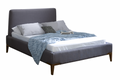 Gray upholstered bed with white mattress and blue blanket on a white background