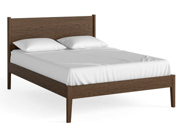 Wooden bed frame with white mattress and pillows on a white background