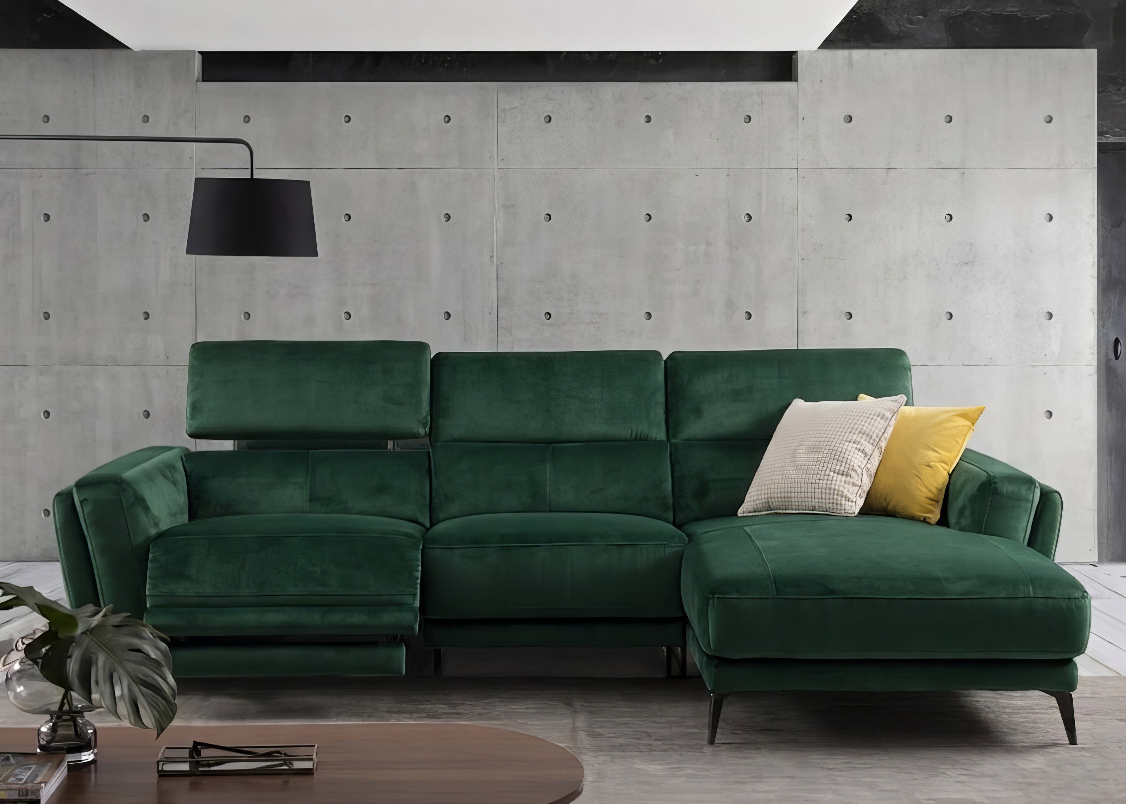 Green sectional sofa in a modern living room with concrete walls.slider_item_nA6FjL