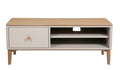A modern low TV stand or coffee table with a light natural wood top and legs, and a white cabinet drawer on the left with a round wooden knob. The right side features open shelving with a center cutout.
