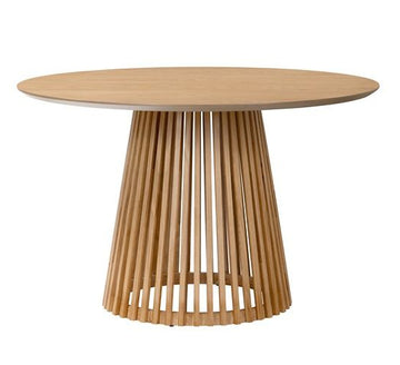 Wooden table with a unique base design on a white background