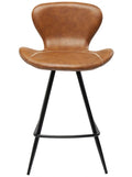 A modern counter stool with a curved, sculptural seat and back upholstered in warm brown leather, supported by a slim black metal frame with four legs.