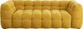 A mustard yellow tufted fabric sofa with a chunky, rounded block design, shown against a plain white background.