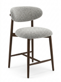 Gray upholstered bar stool with wooden legs on a white background
