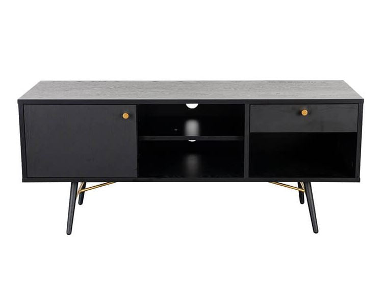 A modern black media console with a textured gray top, two cabinet doors with brass knobs, an open center shelf, and tapered black legs with brass accents, shown against a plain white background.